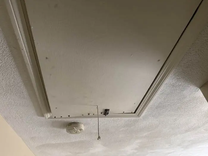 Attic hatch before repair